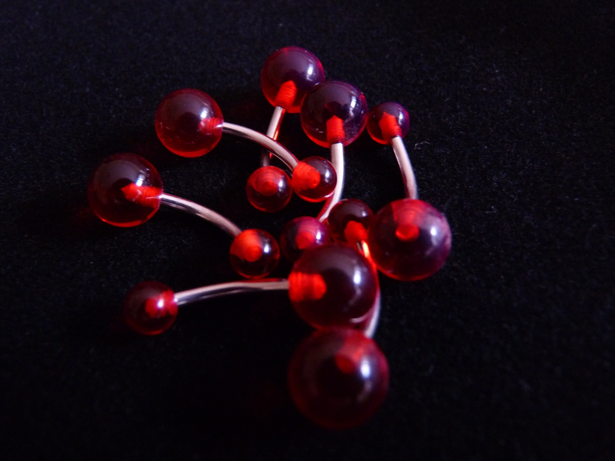 NOMBRIL Translucide rouge ( stock 10 )